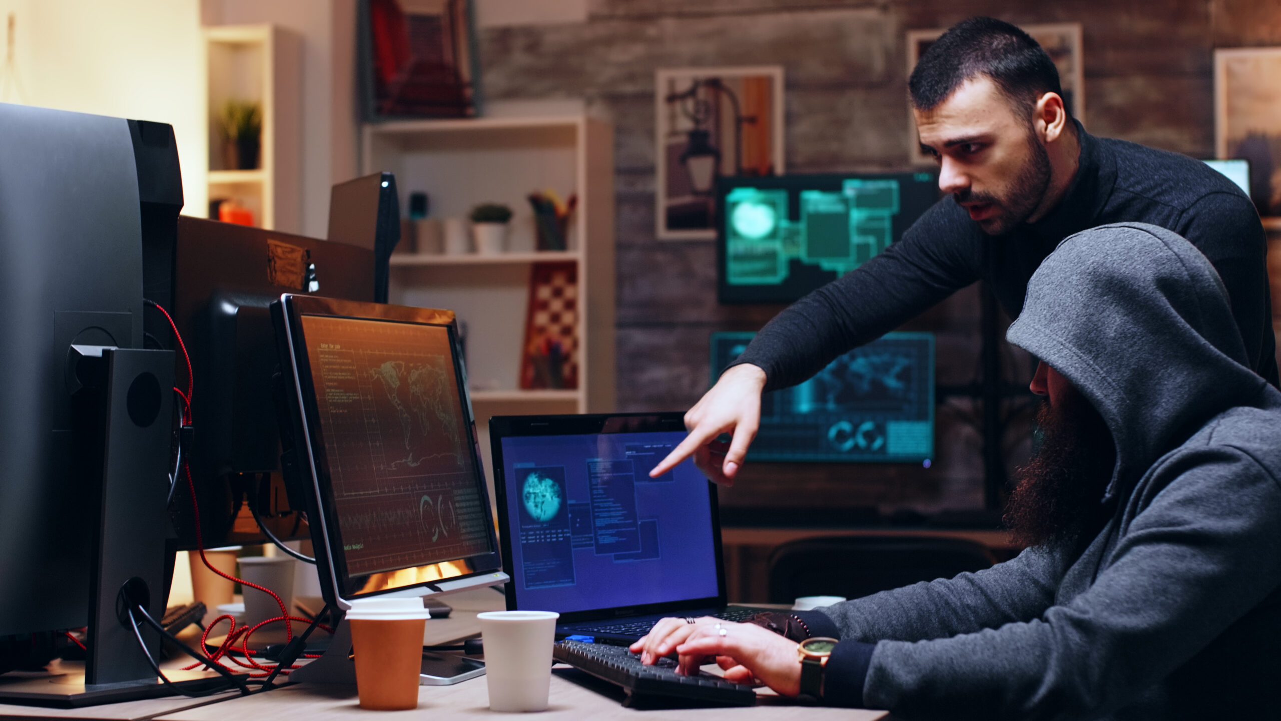 Cybersecurity analysts reviewing threat data and system vulnerabilities