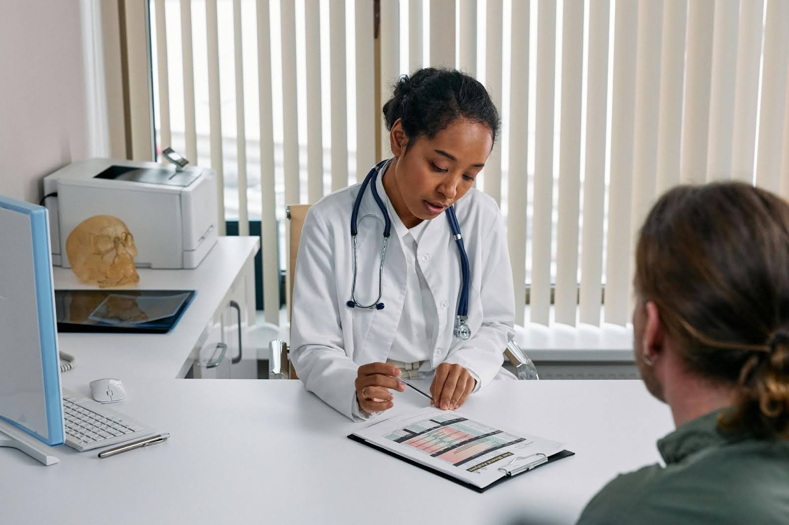 Woman doctor explaining medical processes to a patient